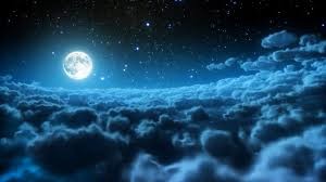 Moon shining in the clouds and stars