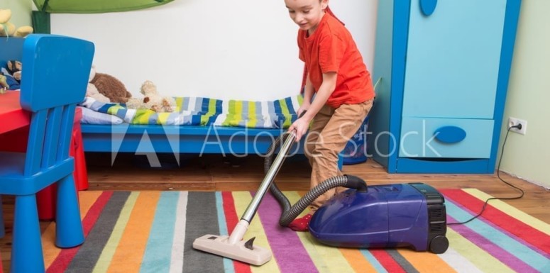 boy cleaning room
